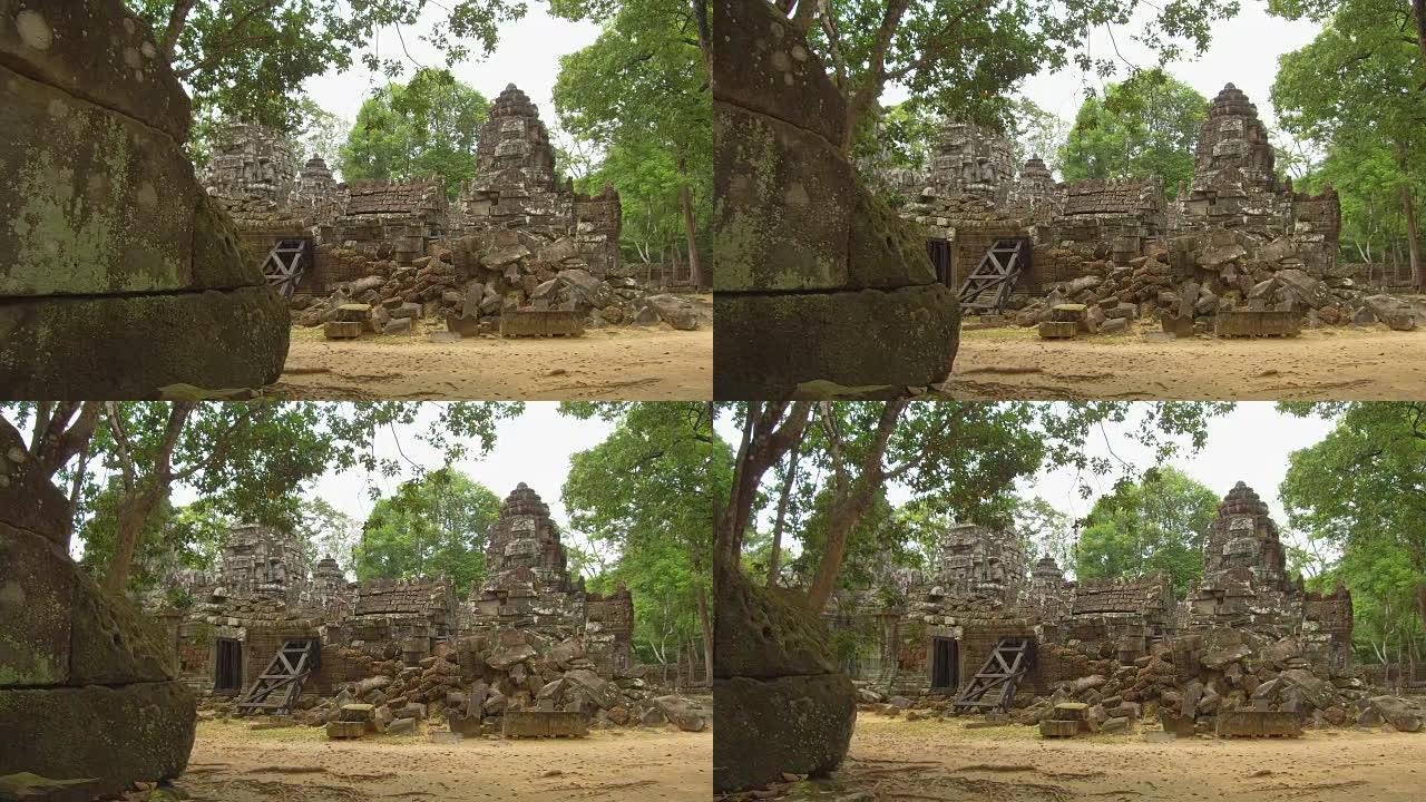 特写:在宁静的柬埔寨森林中，美丽的毁坏的石庙。