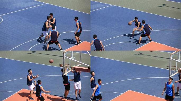 亚洲年轻人在室外球场打篮球