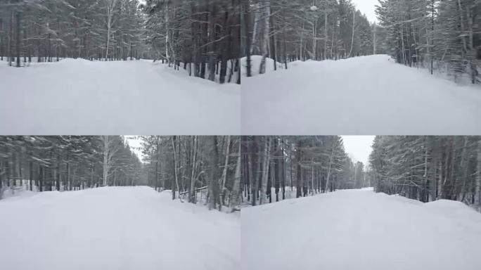 开车穿过大雪覆盖的森林路