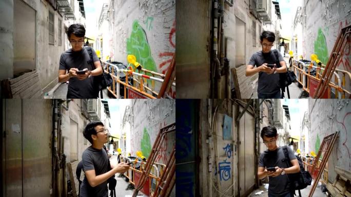 男子在香港城市的智能手机上寻找方向