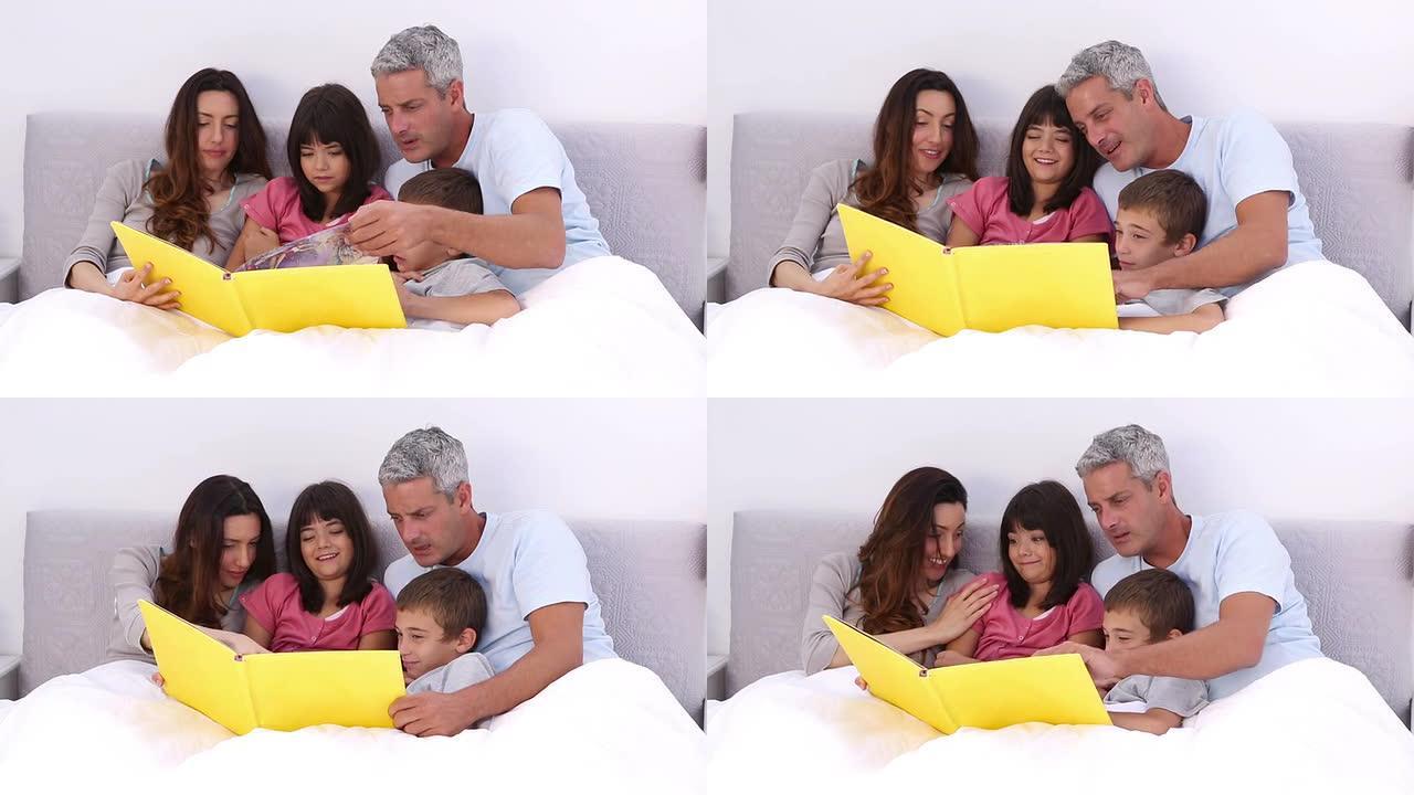 家人在床上读故事书
