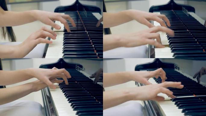音乐家手弹钢琴的特写镜头。没有脸。4K。