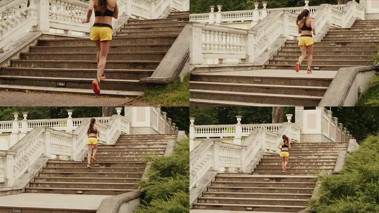 年轻女孩在晨跑时正在爬楼梯。