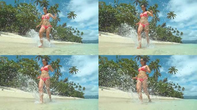 慢动作特写开朗的年轻女子在热带异国情调的岛屿海滩上奔跑