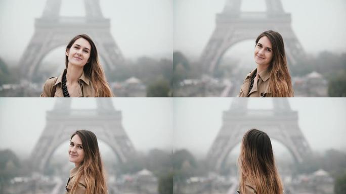 站在法国巴黎埃菲尔铁塔附近的年轻美女肖像，看着相机，微笑着