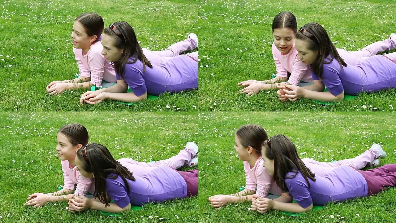 两个女朋友躺在草地上聊天。