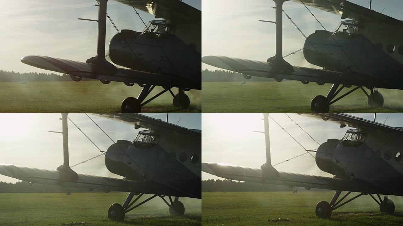带工作发动机的螺旋桨飞机在日落灯光下的拍摄