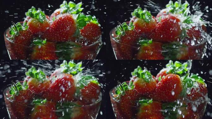 水倒在红色草莓上