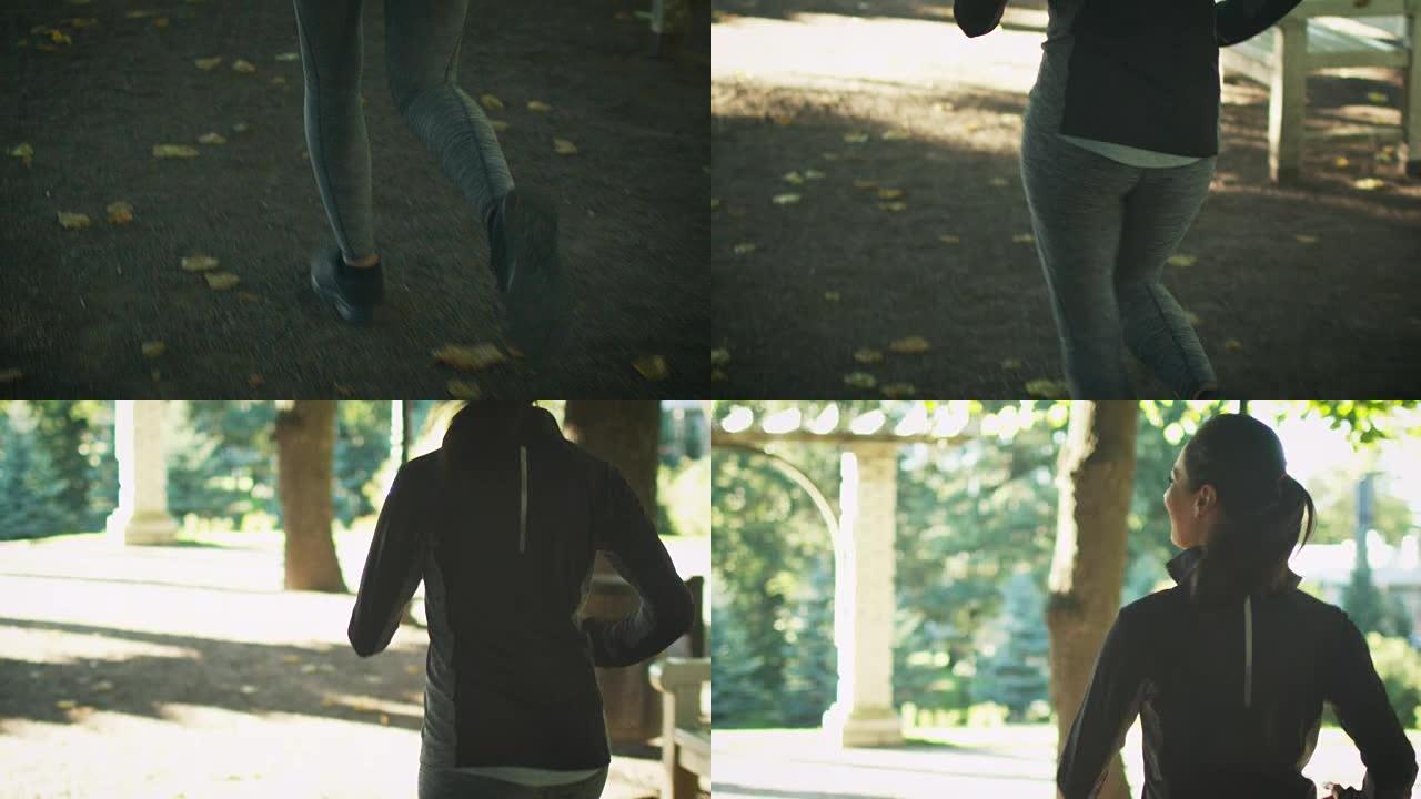 阳光明媚的日子里，女人在公园慢跑。
