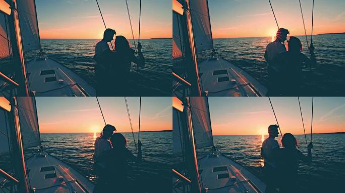 WS爱侣在帆船上看着日落
