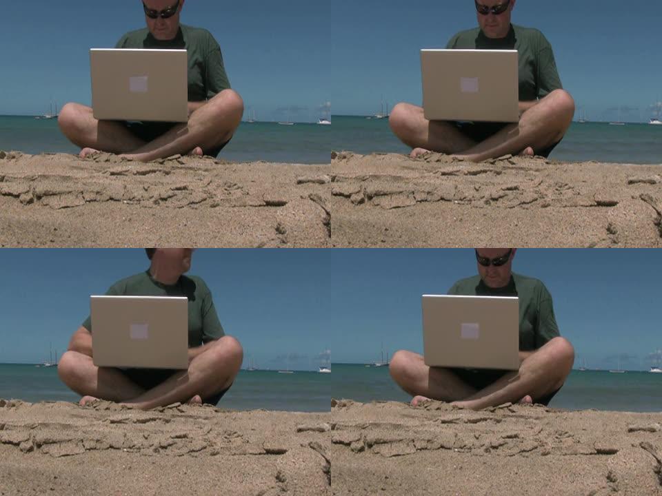 工作狂男子在海滩度假时使用笔记本电脑