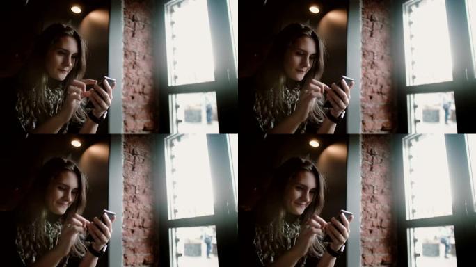 特写肖像。女人在阁楼咖啡馆使用她的智能电话触摸屏设备