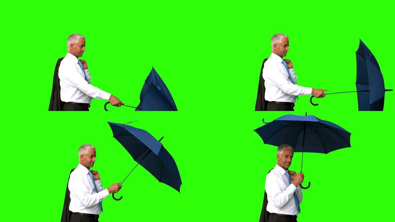 商人在绿屏上伞下