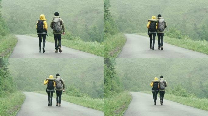 一对年轻夫妇一起在山里散步