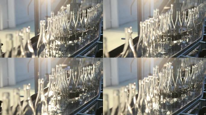 玻璃工厂。在皮带输送机上拆分瓶子。