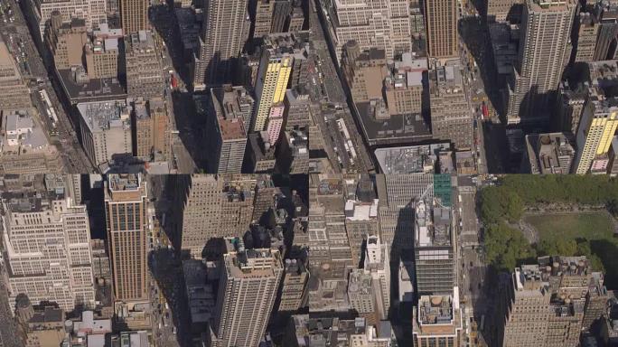 空中: 沿百老汇和第六大街向布莱恩特公园的摩天大楼上方飞行