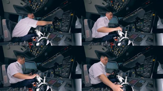 飞行教练在发射前检查飞行模拟器中设备的准备情况
