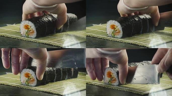 专业厨师正在日本餐厅切寿司卷