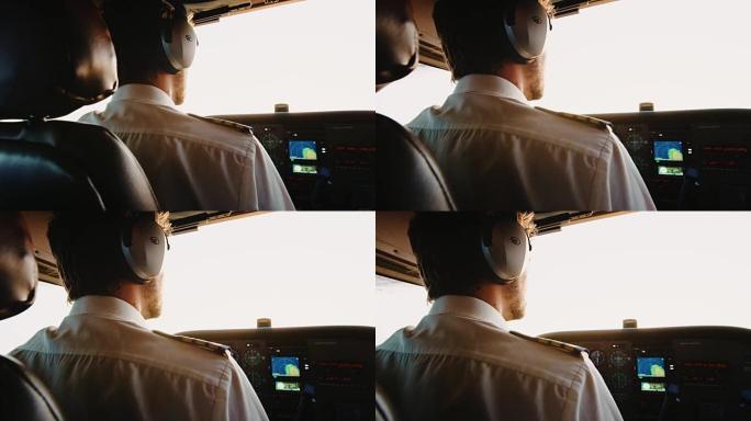 飞行员在日出时驾驶小型飞机。POV驾驶舱视图