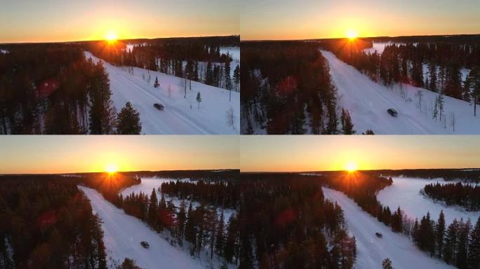 空中: 在金色的冬日日落时分，在一辆驶过白雪皑皑的森林的汽车上方飞行