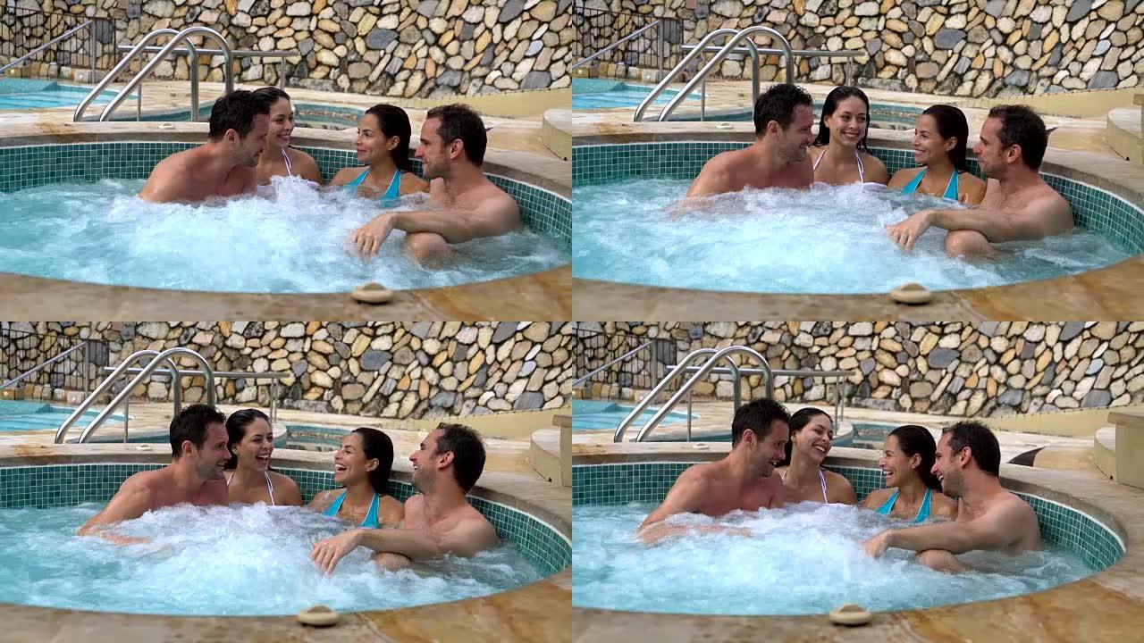 温泉度假胜地的夫妇在热水浴缸里玩得开心
