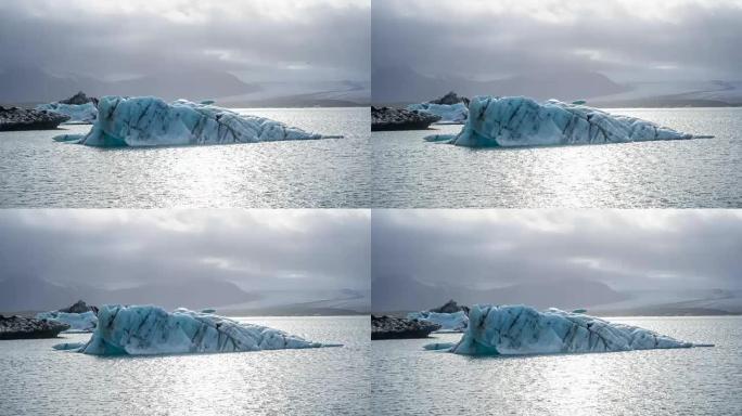 冰山脱离冰川，漂浮在泻湖中