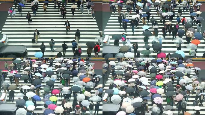 日本人人群的4k镜头在东京新宿商圈新宿JR站的建筑物之间过马路