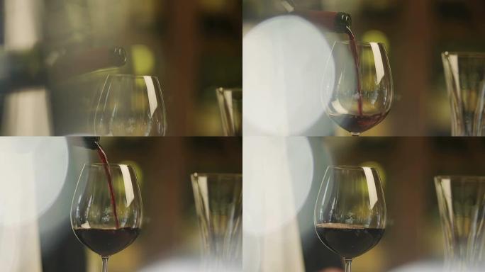 侍酒师在餐厅用葡萄酒填充杯子。特写。