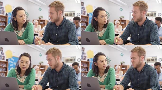 成人教育教师和学生使用笔记本电脑，在R3D上拍摄