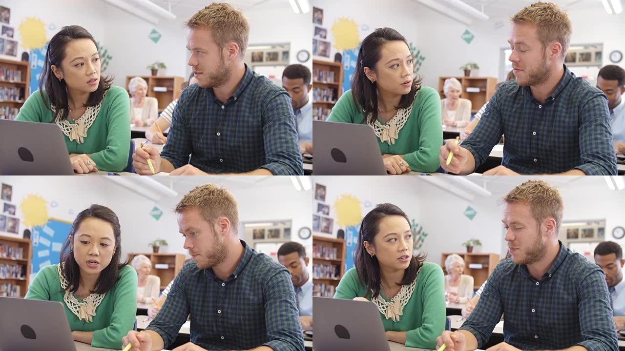 成人教育教师和学生使用笔记本电脑，在R3D上拍摄