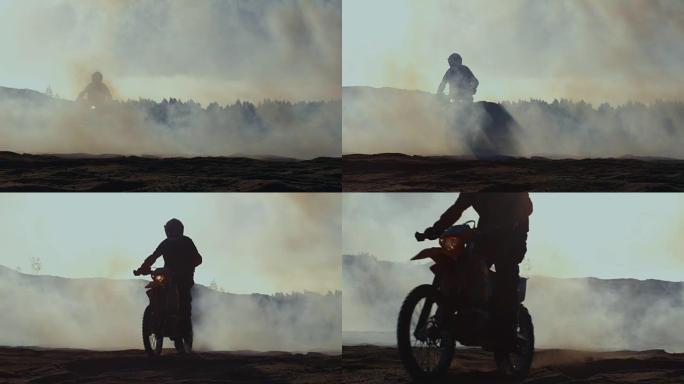 专业的摩托车越野赛摩托车骑手在烟雾和泥土路上行驶。