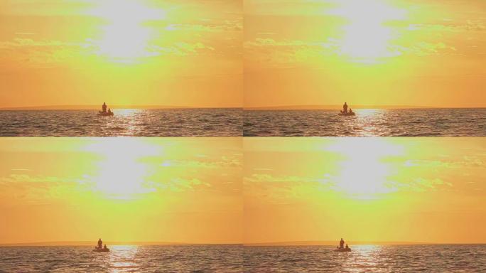 慢动作: 渔船上的渔民在金色的日落时分在海浪上摇摆