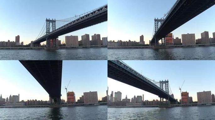HYPERLAPSE: 在金色日落时在标志性的历史悠久的曼哈顿大桥下巡游