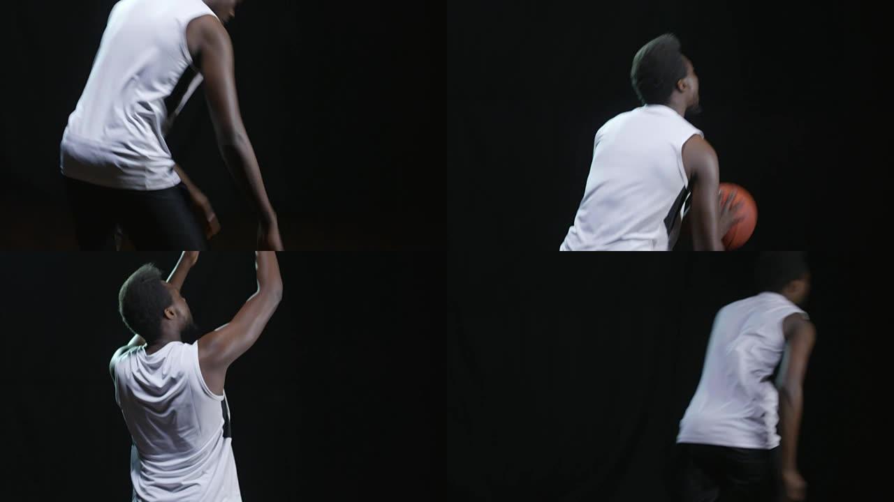 篮球运动员在黑色背景上投掷球