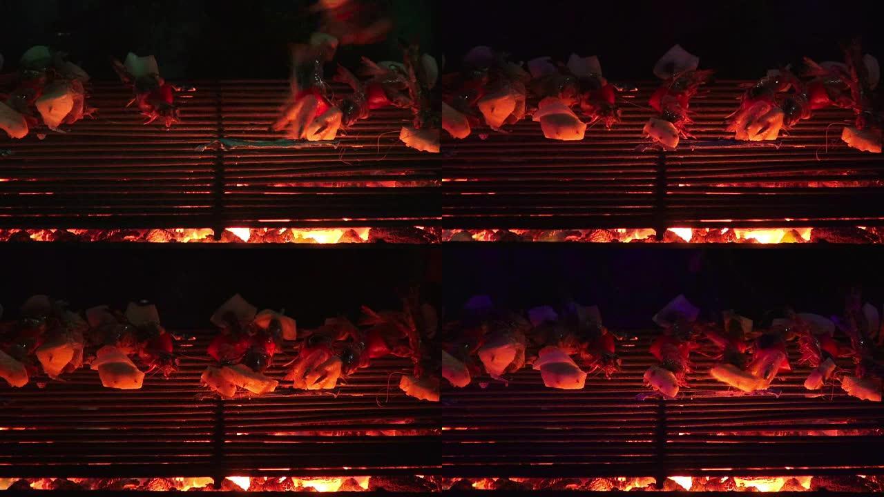 高清格式: 海鲜烧烤烧烤派对。烧烤和美味的海鲜放在烤架上。