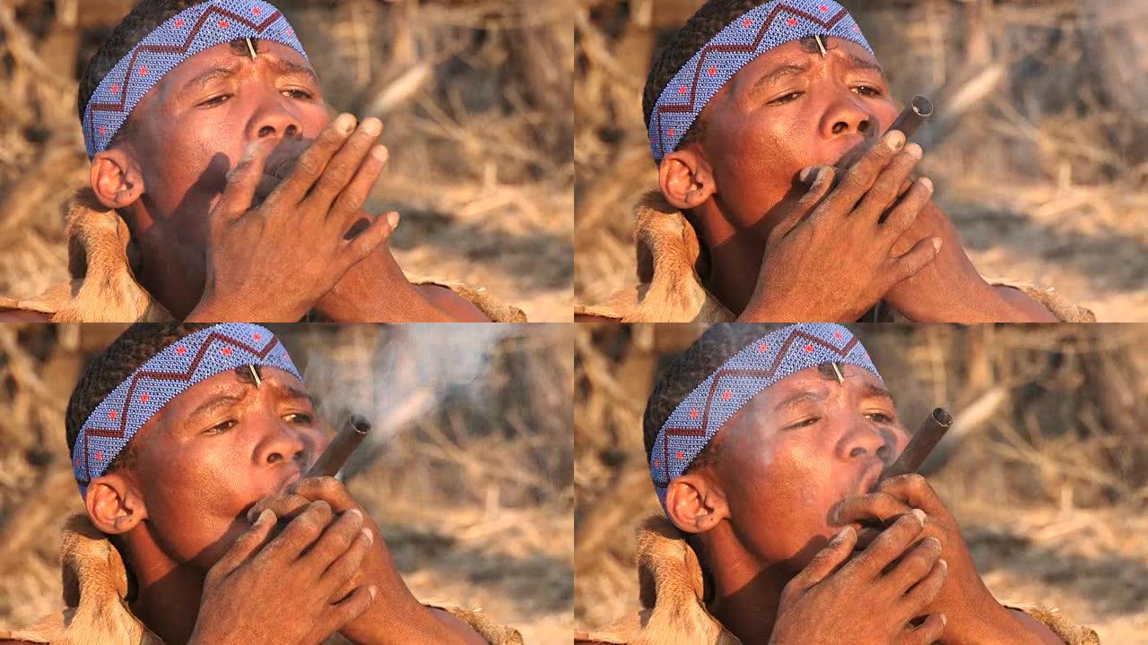 布须曼人用传统的烟斗抽烟