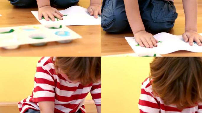 男孩用他的手做画手印