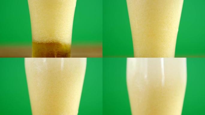 绿色背景上圣帕特里克的一品脱啤酒的特写镜头