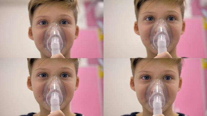 吸入器面罩隐藏在男孩脸上的特写镜头。