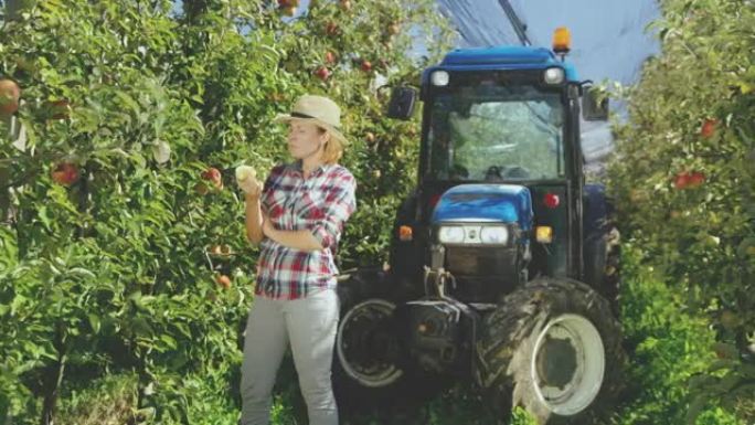 DS女农夫一边吃苹果一边看相机