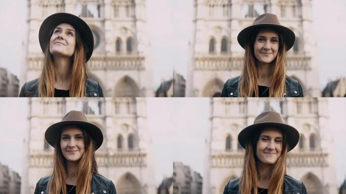 法国巴黎巴黎圣母院附近戴帽子的年轻美女肖像。女性看着相机微笑