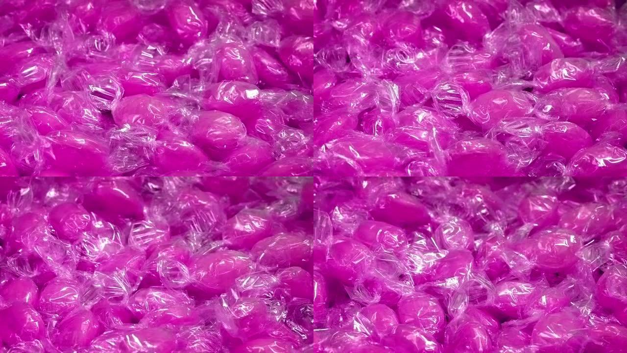 旋转包装纸中的粉色糖果