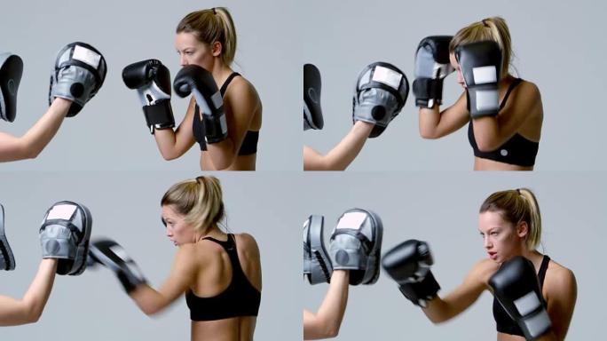 女拳击手训练对抗陪练的手套，在R3D上射击