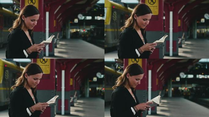 女人在等火车时看书