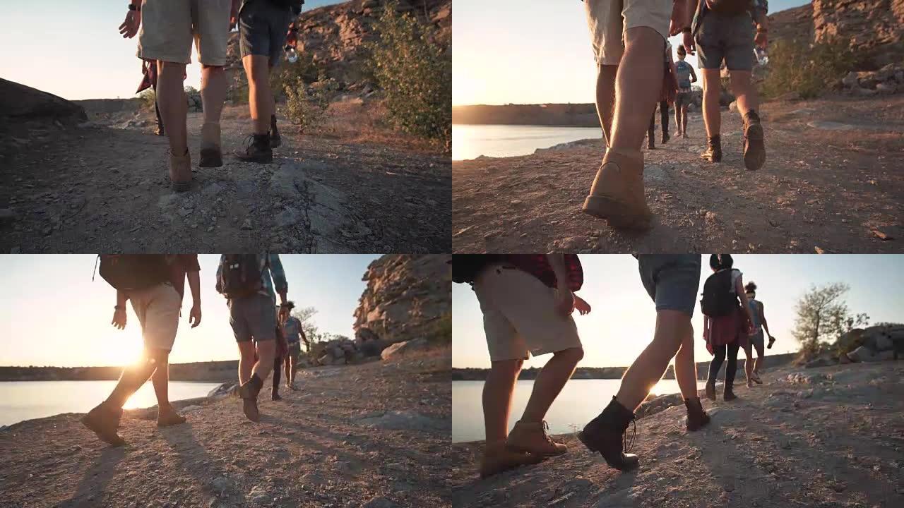 一群朋友在多岩石的海岸线上徒步旅行