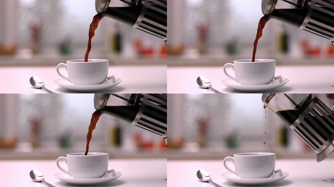 咖啡从咖啡馆倒入厨房的杯子中