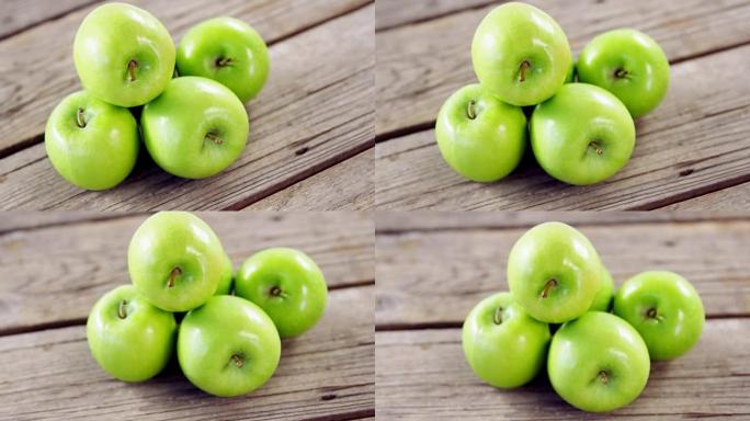 绿苹果排列在木板上
