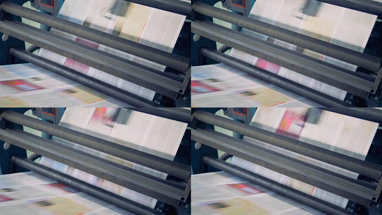 未切割的印刷纸张正在通过印刷机