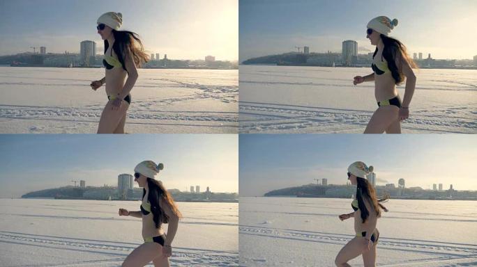 一个女人在冰冻的河上的雪地上奔跑。