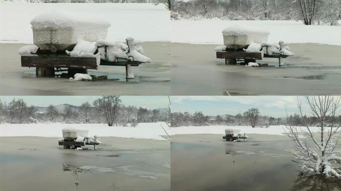 高清: 冰冻的河里的手推车